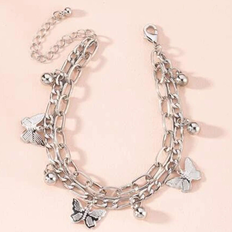 Bring a touch of delicate beauty to your accessory collection with our butterfly charm bracelet. Perfect for any occasion, this bracelet adds a whimsical and stylish flair to your look."