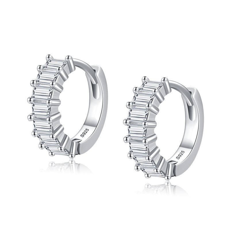Sterling silver huggie earrings with sparkling zircon stones - a versatile and stylish addition to any jewelry collection.